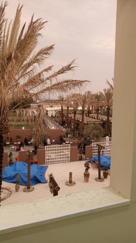 a model of a desert with palm trees and buildings at Kinda Resort Luxury Villas in Taif