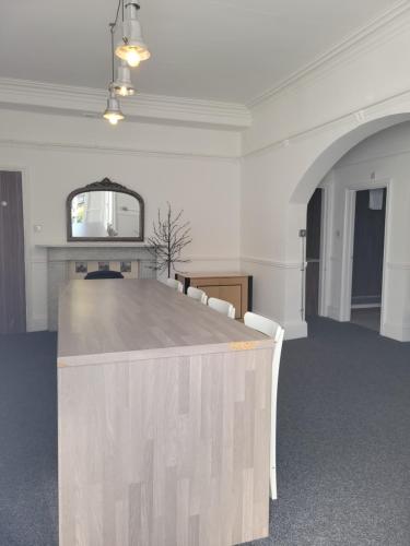 a conference room with a large table and chairs at Nysdill Accommodation Ltd in Norwich