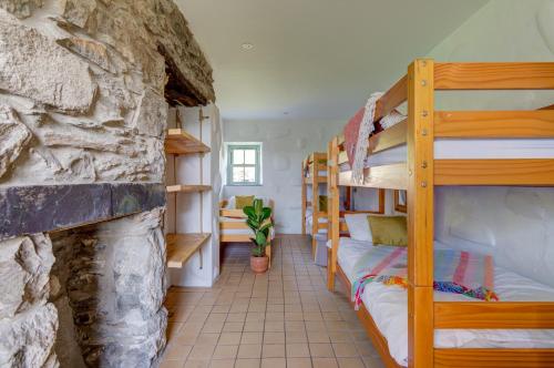 Ένα ή περισσότερα κρεβάτια σε δωμάτιο στο Crashpad Lodges at Yr Helfa