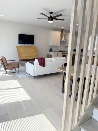 a living room with a white couch and a table at 2 Bd - Bourbon Lovers Dream - Clemson & Greenville in Easley