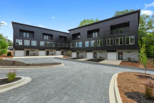 an empty street in front of a black building at 2 Bd - Bourbon Lovers Dream - Clemson & Greenville in Easley