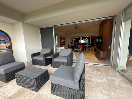 a room with couches and chairs and a living room at Paramount Bay - Spectacular Ocean View in Puerto Vallarta