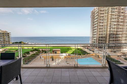 a balcony with a view of the ocean from a building at Luxury Coastal Apartment with Panoramic Views S9 in Sliema