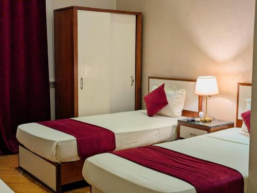 Postel nebo postele na pokoji v ubytování Nour Hostel