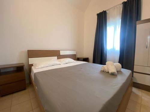 a bedroom with a bed with a towel on it at Le Dauphin Villa 3 Bedroom 5min Walk to Beach - LB2 in Flic-en-Flac