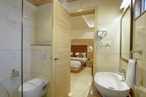 Koupelna v ubytování Hotel Cherry Wood