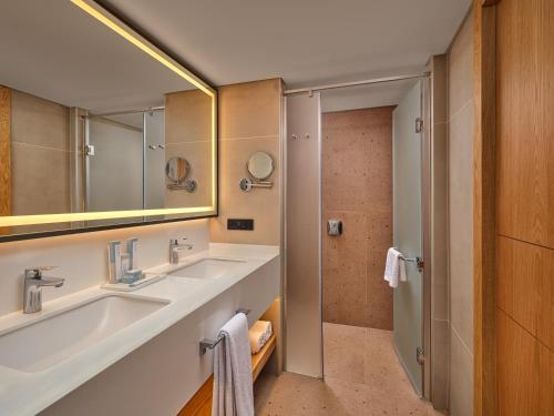 a bathroom with a sink and a mirror at Paloma Grida in Belek