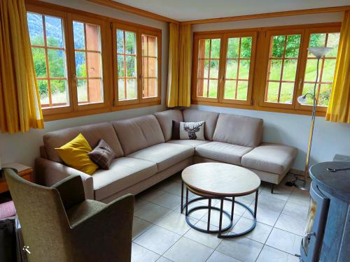 a living room with a couch and a table at Cresta in Fiesch