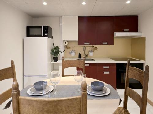 a kitchen and dining room with a table and chairs at Duplex Apartment in Mons Center 3 in Mons
