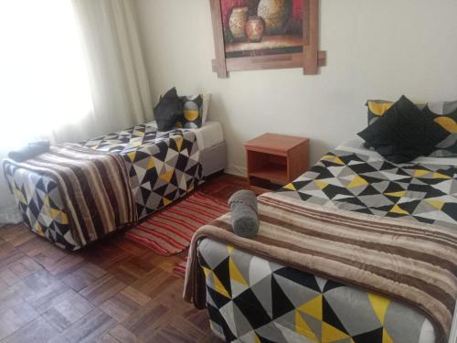 Katil atau katil-katil dalam bilik di Marli Guesthouse