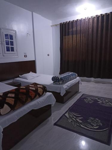 Postel nebo postele na pokoji v ubytování Awi Guest House