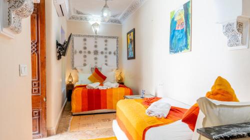 a room with two beds in a room at Riad Abaka hotel & boutique in Marrakech
