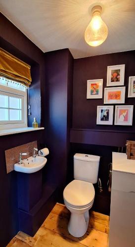 a bathroom with a toilet and a sink at The Chapel, Dummer in Dummer