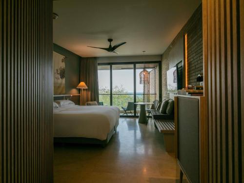 Uma cama ou camas num quarto em Sofitel Barú Cartagena