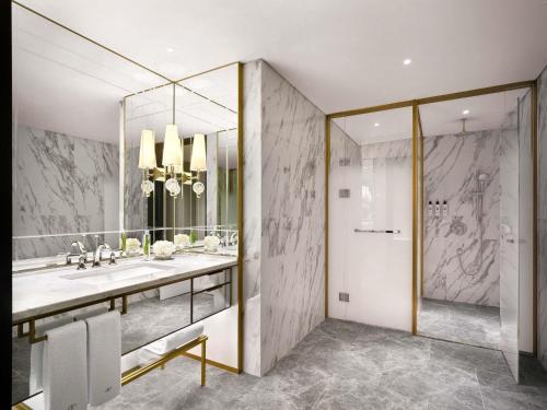 a bathroom with a sink and a mirror at Sofitel Ambassador Seoul Hotel & Serviced Residences in Seoul
