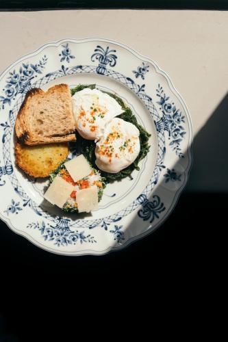 a plate of eggs and bread on a table at Komana Hotel Binbirdirek in Istanbul