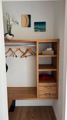 a wooden book shelf in a room at Refúgio da Quinta Nere Maitia in Santarém