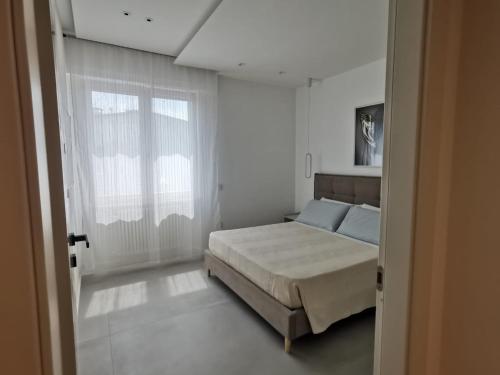 Ένα ή περισσότερα κρεβάτια σε δωμάτιο στο CIVICO 51 Luxury Apartment