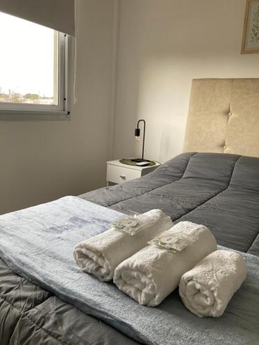 Ένα ή περισσότερα κρεβάτια σε δωμάτιο στο Como en casa