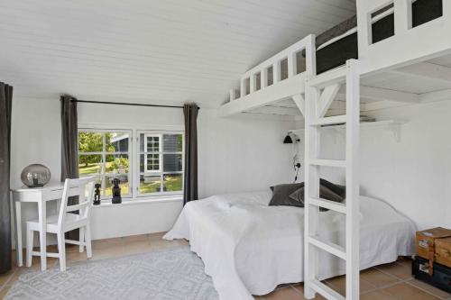 a bedroom with a white bunk bed and a desk at Magical Sea View From Terrace To Horizon 1 in Listed