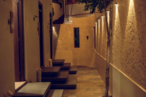 a long hallway with stairs in a building at Windy Hill Hotel And Restaurant in Bungmati