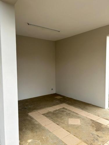 an empty room with a white wall and a tile floor at Lovely home in Ebene with beautiful views in Ebene