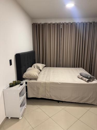 Cama o camas de una habitación en Flat Congonhas sp