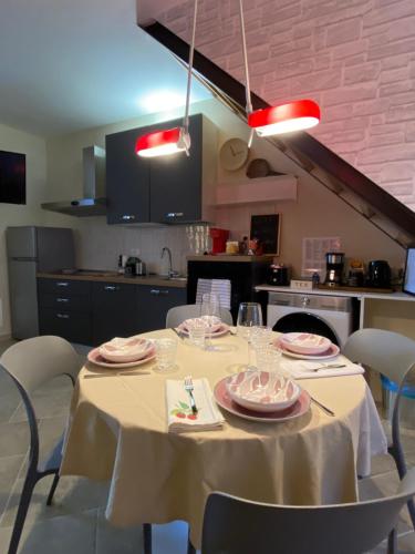 a table with a white table cloth on it in a kitchen at Casa Danesi in Monteleone dʼOrvieto
