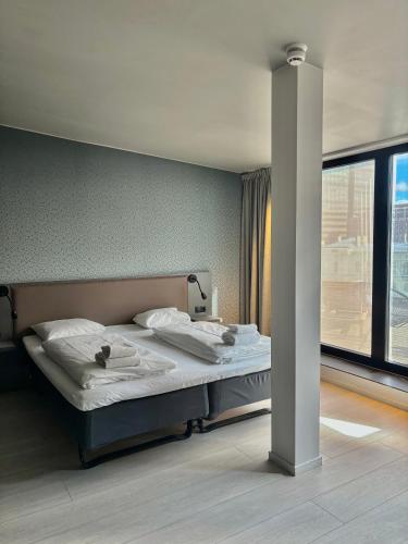 En eller flere senge i et værelse på Comfort Hotel Xpress Central Station