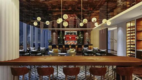a dining room with a large table and chairs at Naru Ambassador Hotel Seoul - MGallery Collection in Seoul
