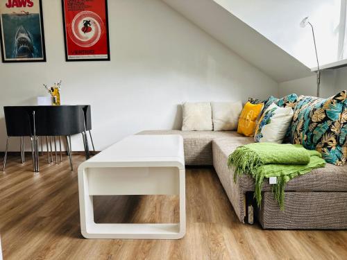 a living room with a couch and a table at Ferienwohnung an der Therme in Bad Rodach