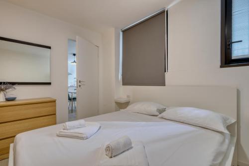 Ένα ή περισσότερα κρεβάτια σε δωμάτιο στο I-Host Apartment - Maffei 20