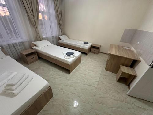 Katil atau katil-katil dalam bilik di New Hotel BEKARYS