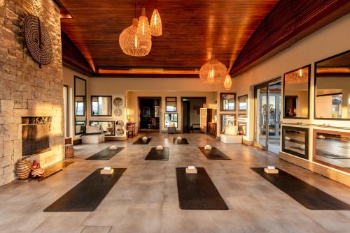 a large room with many yoga mats on the floor at Pezula Nature Retreat in Knysna