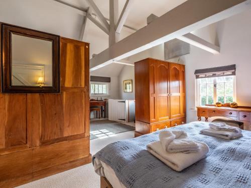 a bedroom with a bed with two towels on it at 1 bed in Beaulieu 53042 in Beaulieu