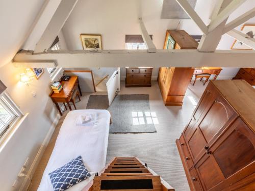 an overhead view of a room with a bed and a desk at 1 bed in Beaulieu 53042 in Beaulieu