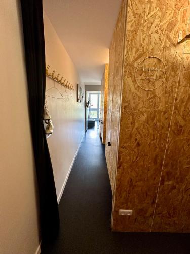 a hallway with a walk in shower in a room at Le refuge cosy du Varet - Arc 2000 - Ski IN OUT - La conciergerie du Varet in Arc 2000
