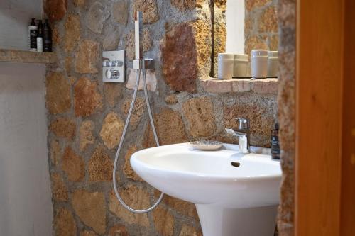 a bathroom with a sink and a shower at Terra Ionian in Áyios Ilías