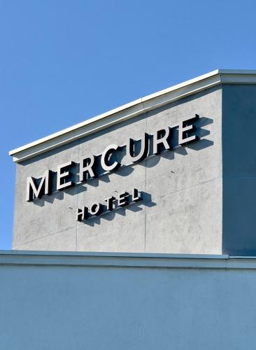 a sign on the side of a mercier hotel at Mercure Chartres Est in Chartres
