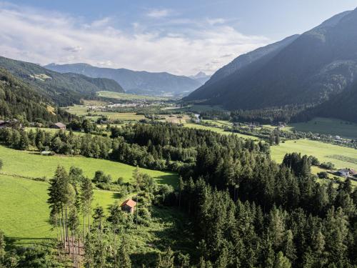 an aerial view of a valley with mountains at Anewandterhof in Brunico