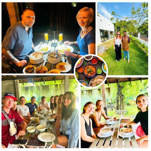 a group of people sitting at a table eating food at The Ivy Lake in Anuradhapura