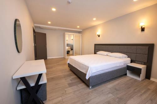 Ένα ή περισσότερα κρεβάτια σε δωμάτιο στο Venesia Otel