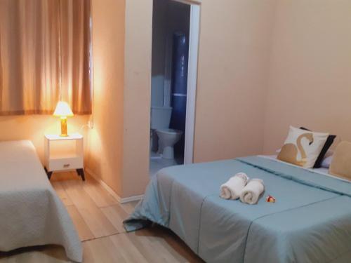 Postel nebo postele na pokoji v ubytování Pousada Villa Dom Carlos