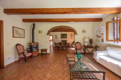 a living room with a couch and a table at La casa di Oliveto Private villa with pool in Oliveto