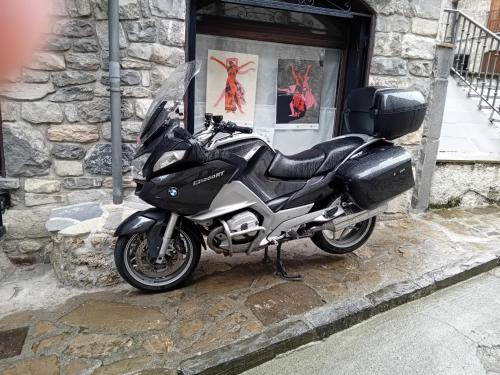 a motorcycle parked in front of a building at HOTEL FAMILIAR MAXIMINA in Sallent de Gállego