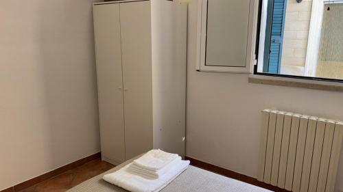 Postel nebo postele na pokoji v ubytování Sotto la Corte di Tata Nino