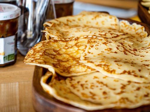 three pancakes stacked on top of each other on a table at Mercure Annemasse Porte De Genève in Gaillard