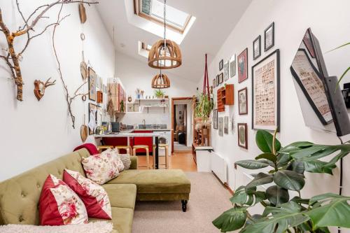 a living room with a couch and a table at Quirky Stay 10 min walk to city with free parking in York