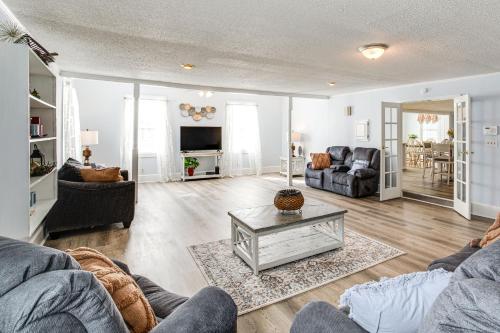 a living room with two couches and a table at Large Yard and Historic Charm Orangeburg Retreat! in Orangeburg