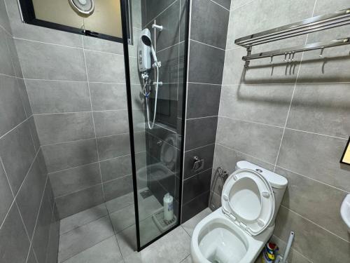 a bathroom with a shower and a toilet at Simple Stay Aston Acacia Bukit Mertajam in Bukit Mertajam
